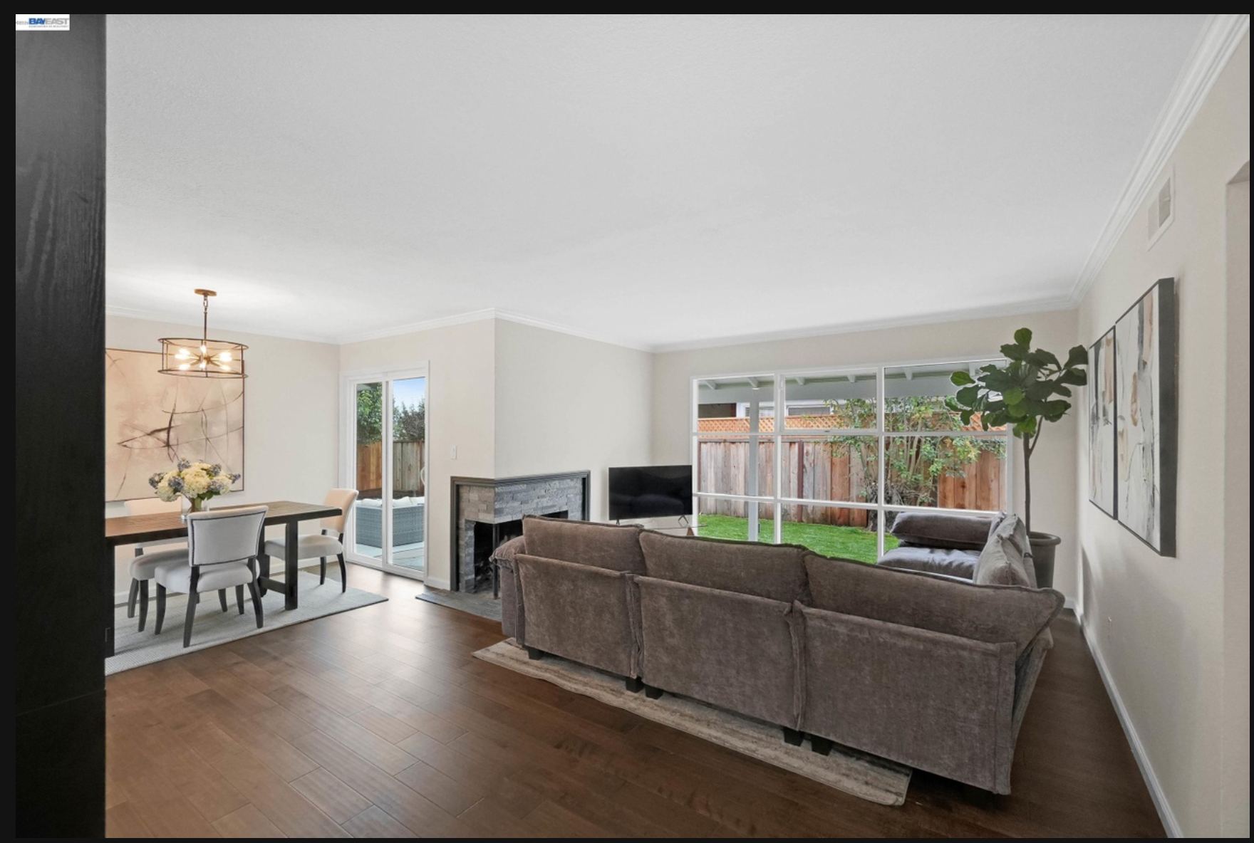 Living room with fireplace and dining area