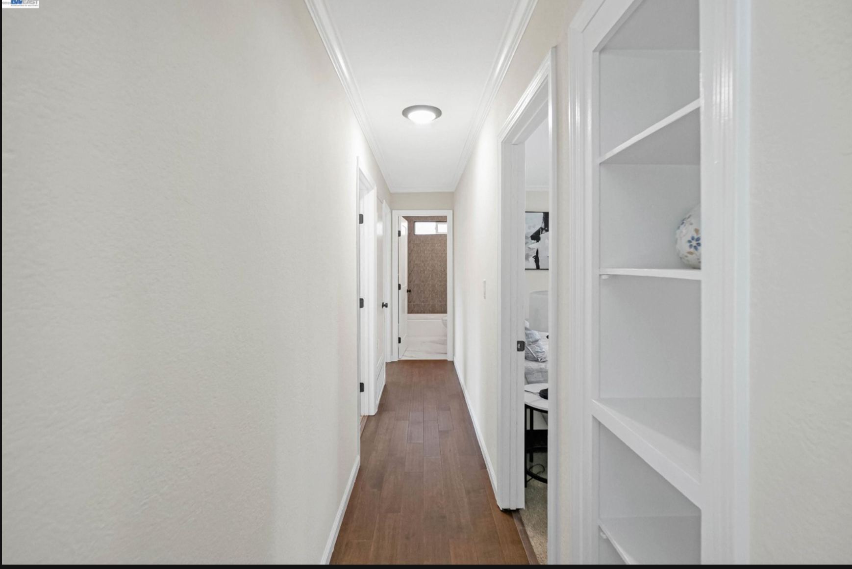 Hallway connecting bedrooms and bath